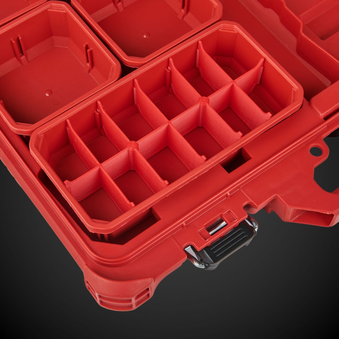 Red tool box with red 12-Way Low Double Bin Divider on a black background