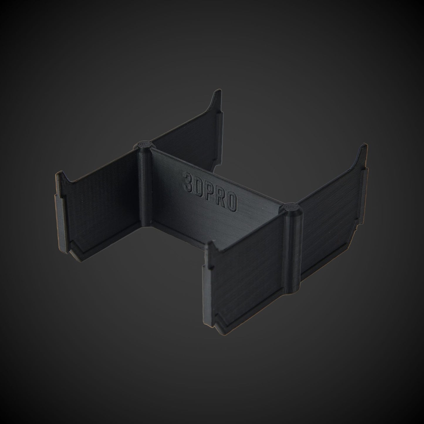 Black 3D-printed object with '3DPRO' branding on a dark gray background