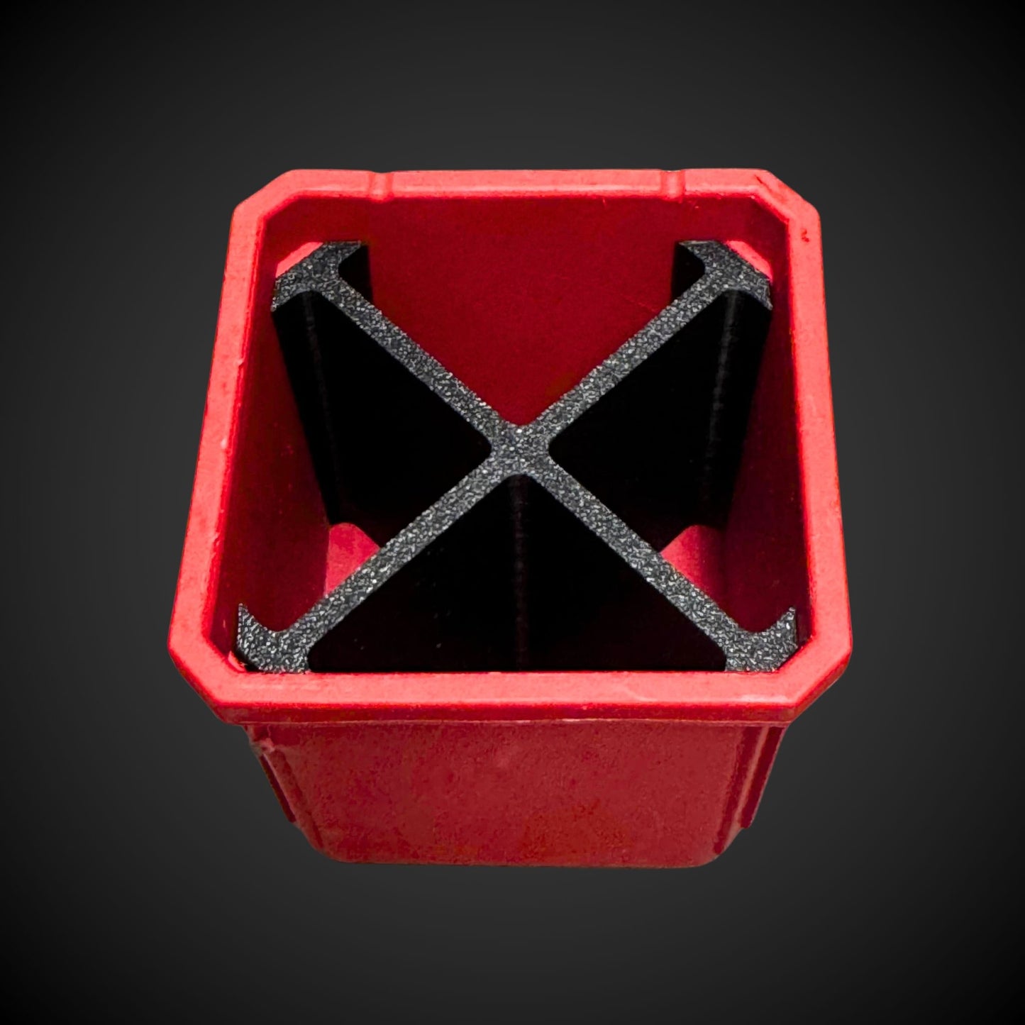 A 3D printed red and black 4-way divider designed to fit inside a Milwaukee Packout standard organizer bin.
