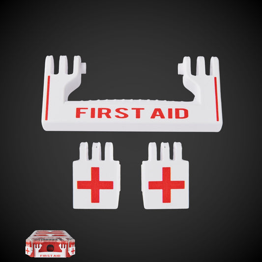 A set of white first aid latches with red text and red crosses, designed for a Milwaukee Packout first aid kit.