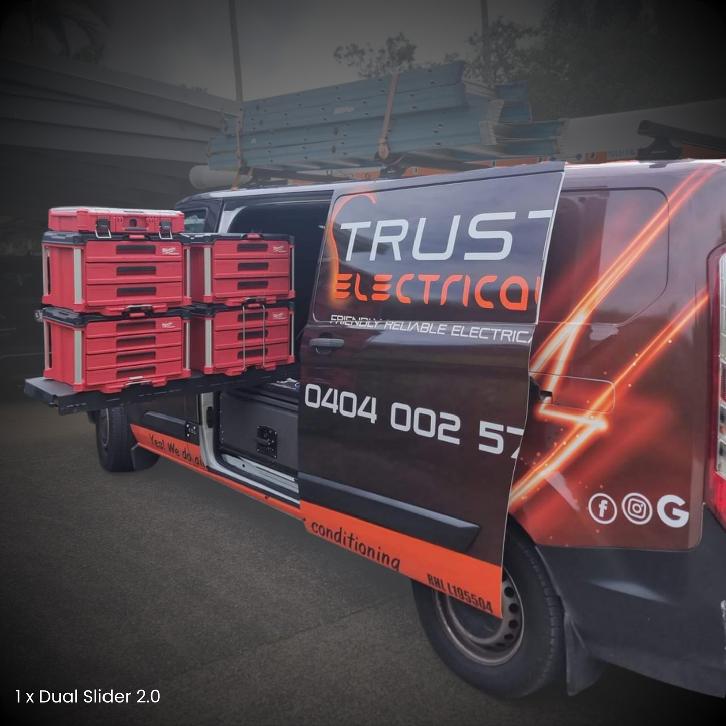 Van with red tool cases on the back, branded 'Trust Electrica'.