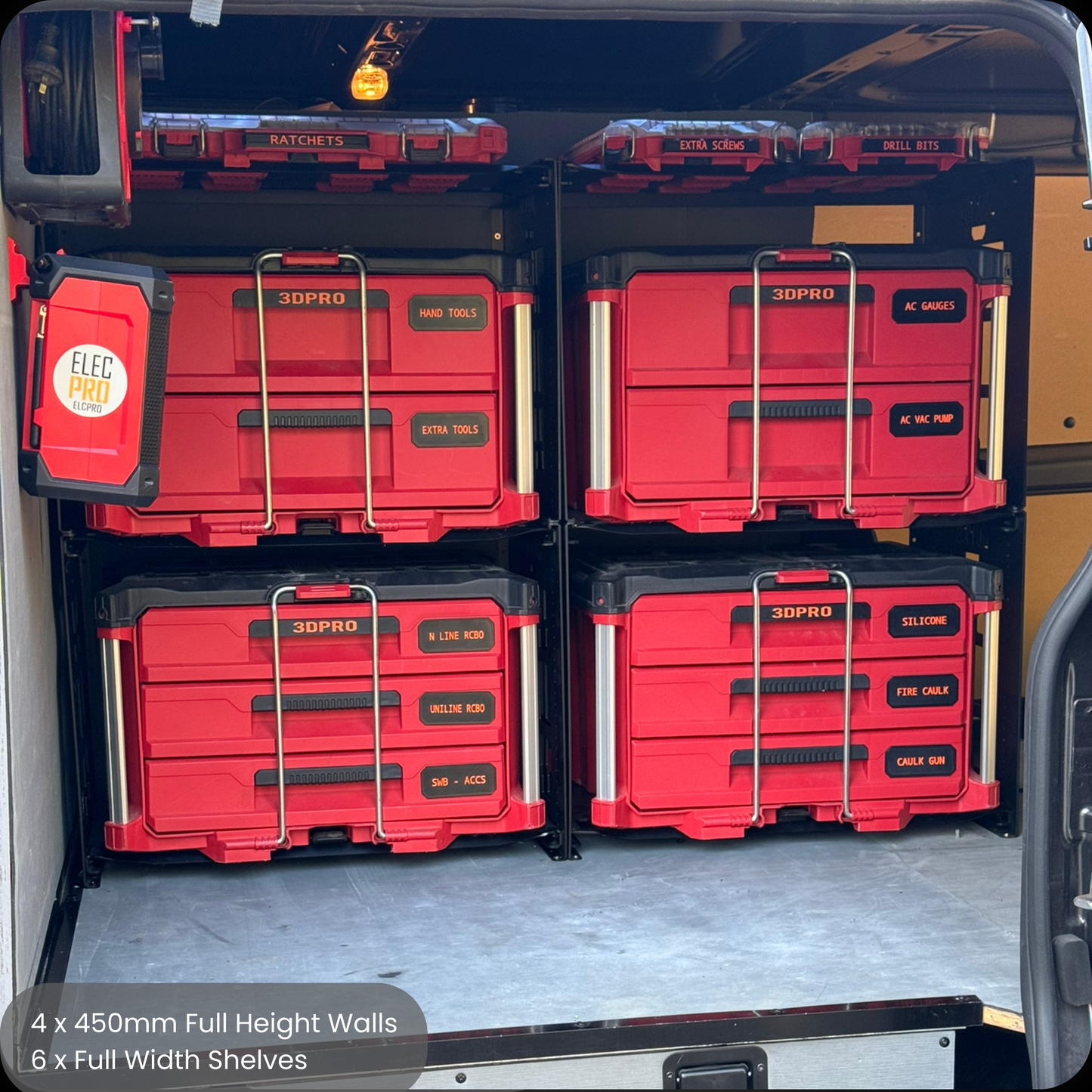 Red storage containers stacked inside a vehicle with visible labels.