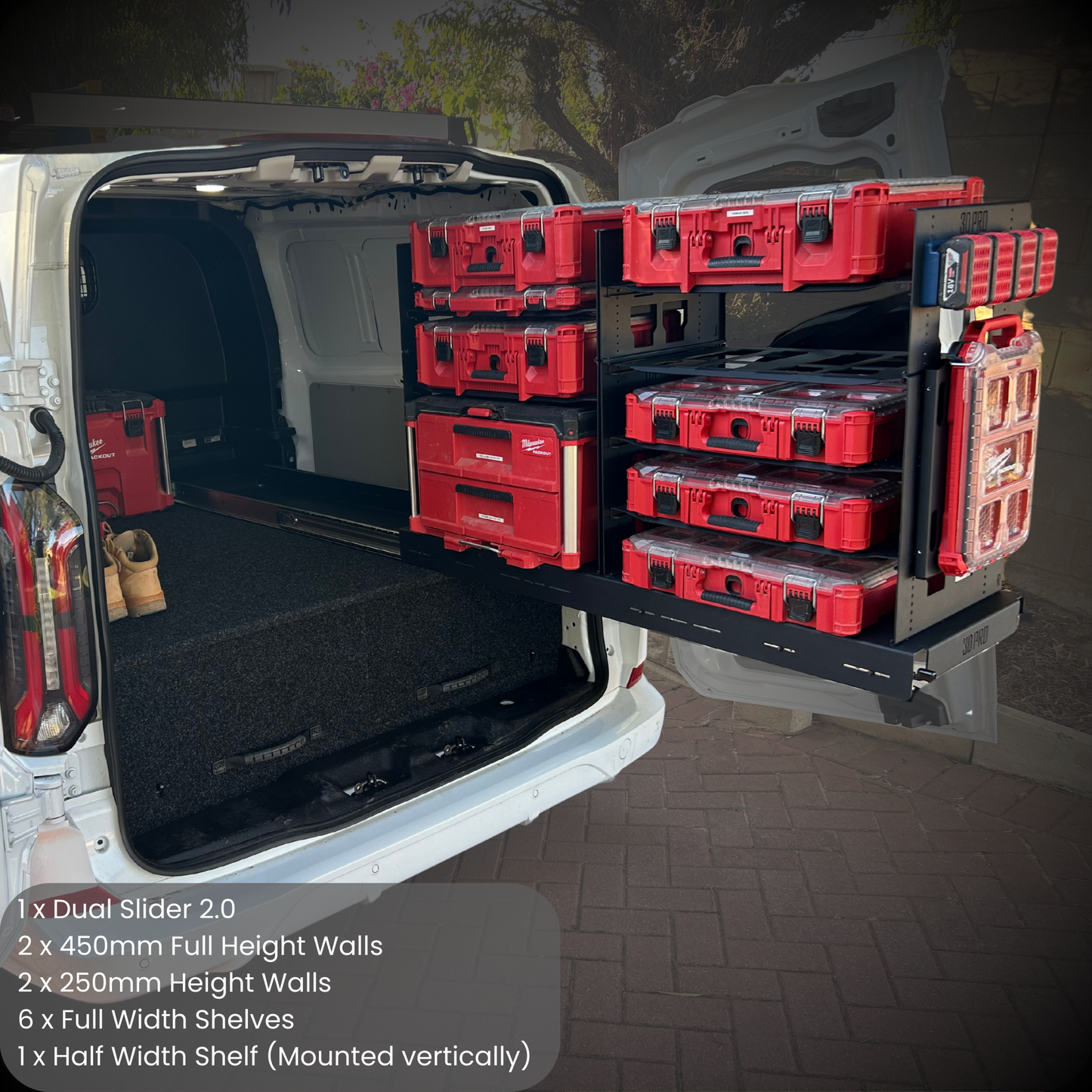 Van with a tool storage system in the back, featuring red toolboxes and shelves.