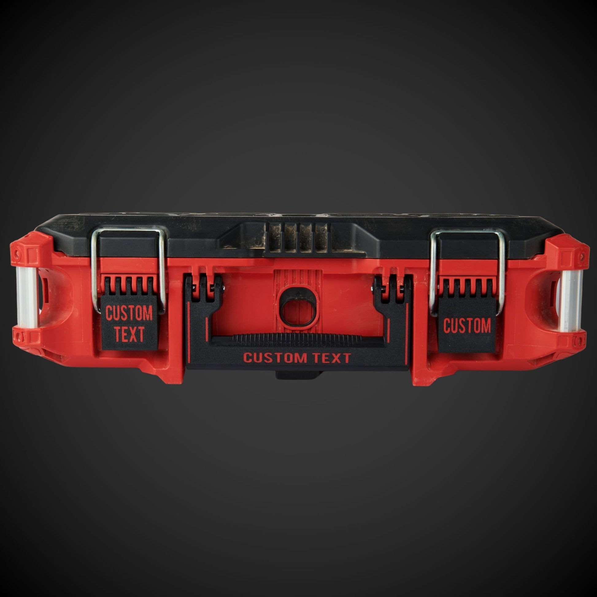 Red and black tool case with custom text on a dark background