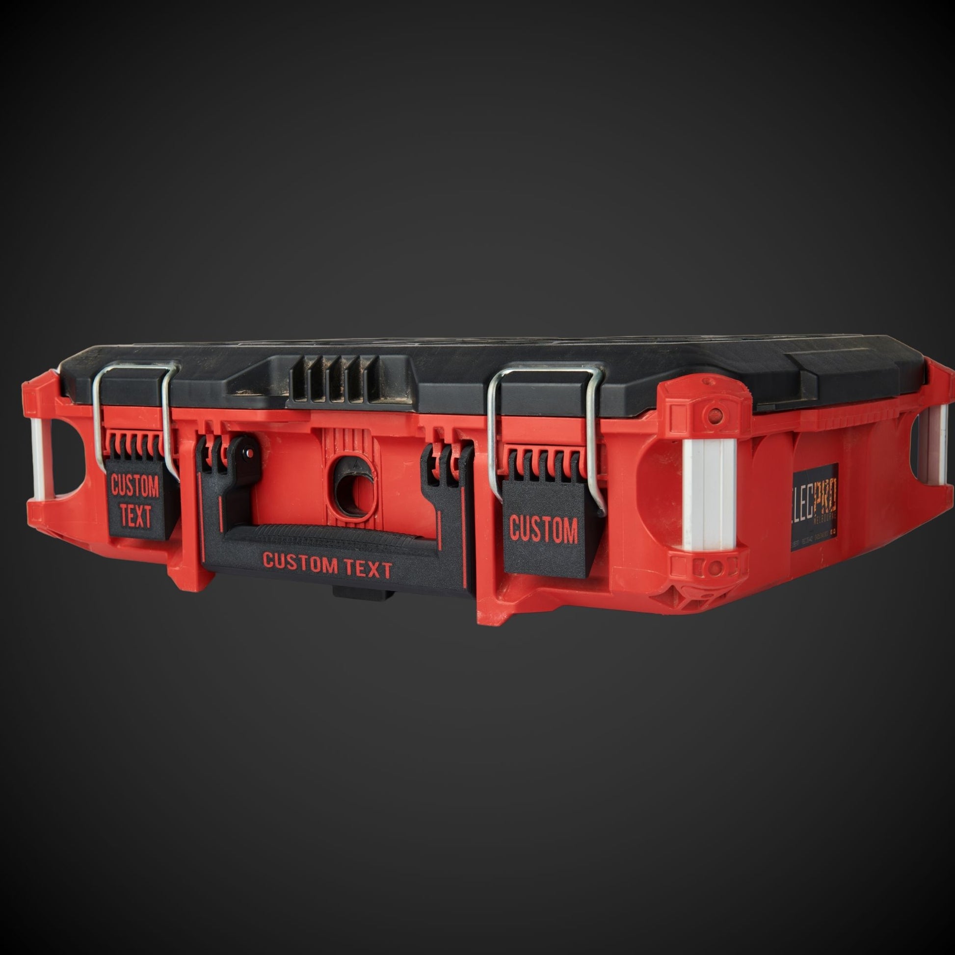 Red and black tool belt with custom text on a dark background
