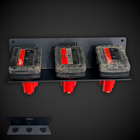 Three gray and red electronic devices mounted on a M12 Battery Holder (Pack a Shelf) with a dark background.