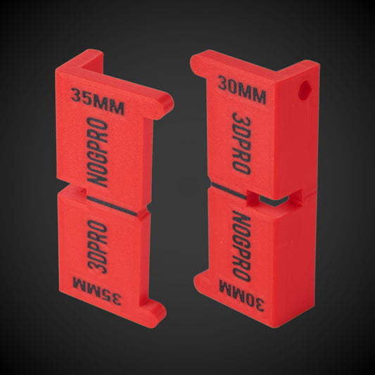 Two red Nog Pro - Noggin SetBacks labeled '35MM' and '30MM' with the text 'NOGPRO' on them, designed for installing noggins at correct setbacks.