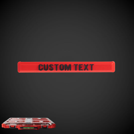 Custom text label in red on a red background, designed to clip onto a tool storage handle.