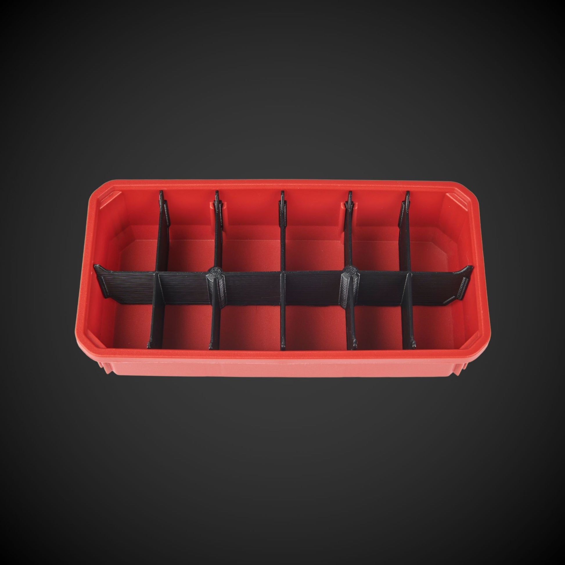 A red 12-Way Low Double Bin Divider (MP) with black dividers, designed for organizing tools in a Milwaukee Packout low organizer.