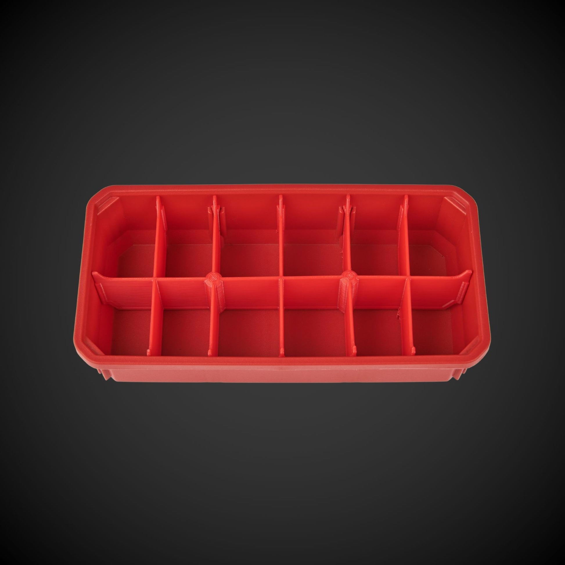 A red bin with red A red 12-Way Low Double Bin Divider (MP) with black dividers, designed for organizing tools in a Milwaukee Packout low organizer. dividers, designed for organizing tools in a Milwaukee Packout low organizer.
