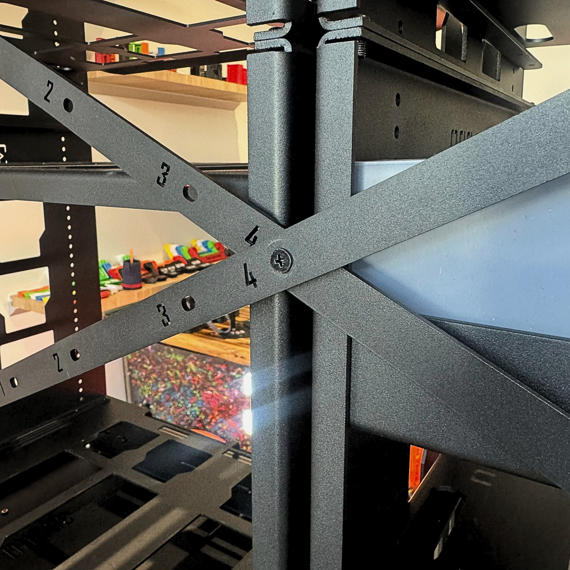 Close-up of a metal pack a shelves with 2.0 Slider Bracing Kit (Pack A Shelf) 