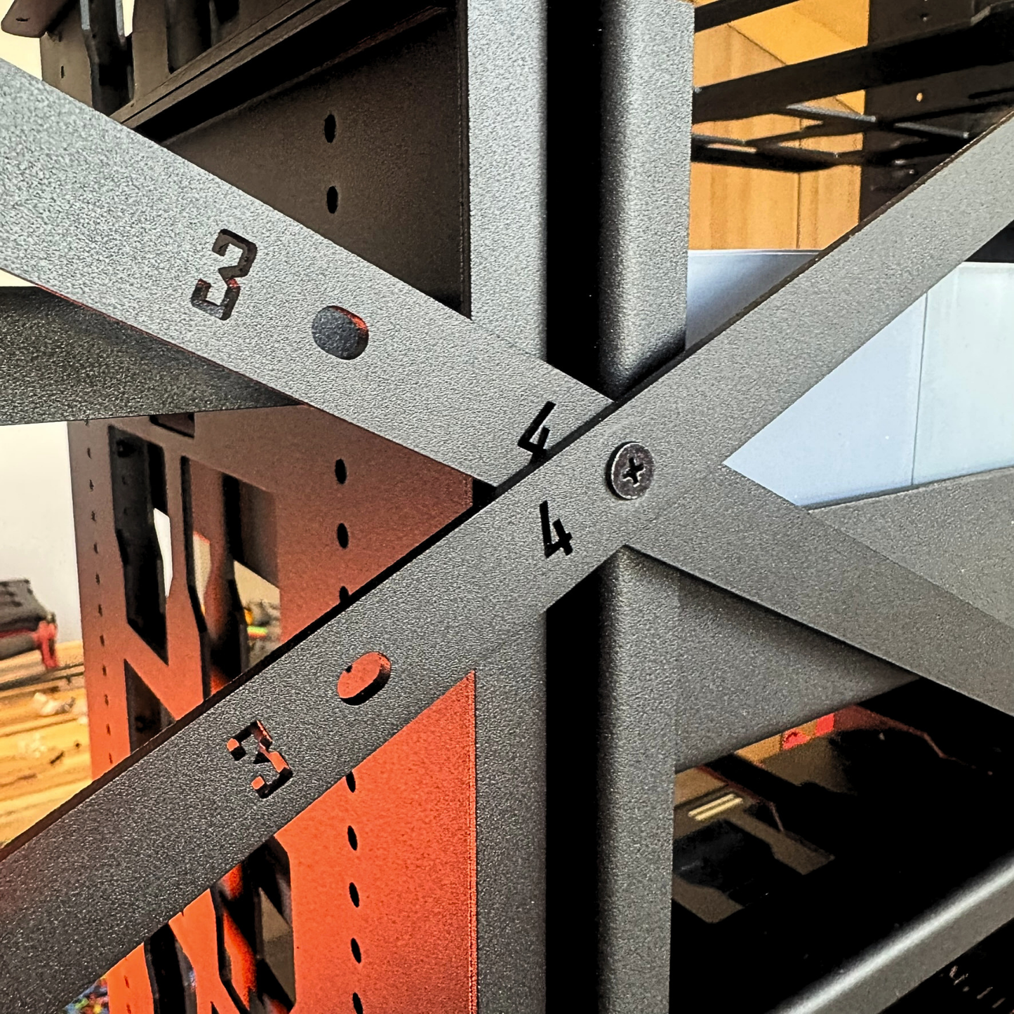 Close-up of a metal frame structure with numbered bars
