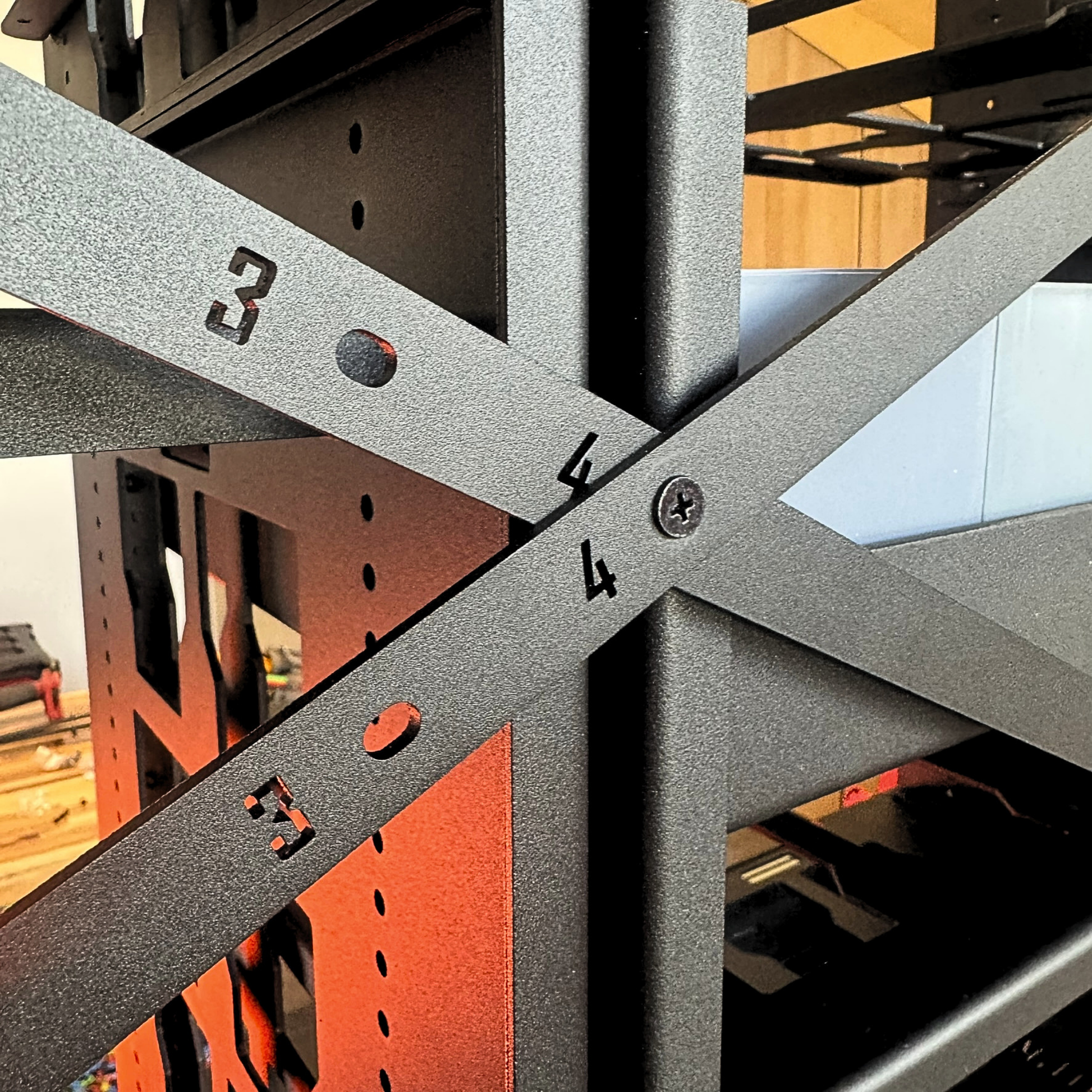 Close-up of a metal frame structure with numbered bars