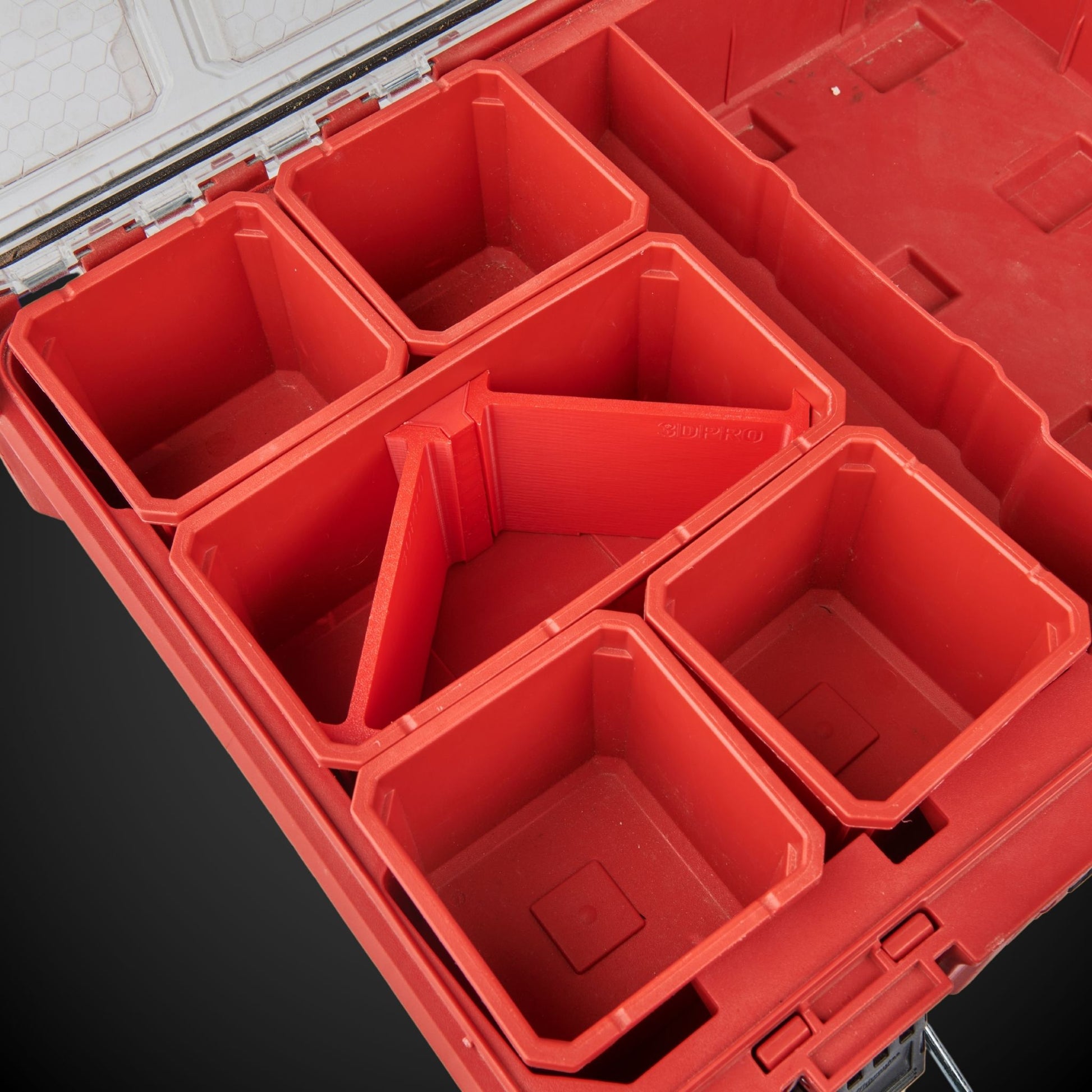 Red 3-Way Standard Double Bin Divider (MP) in an open toolbox on a black background