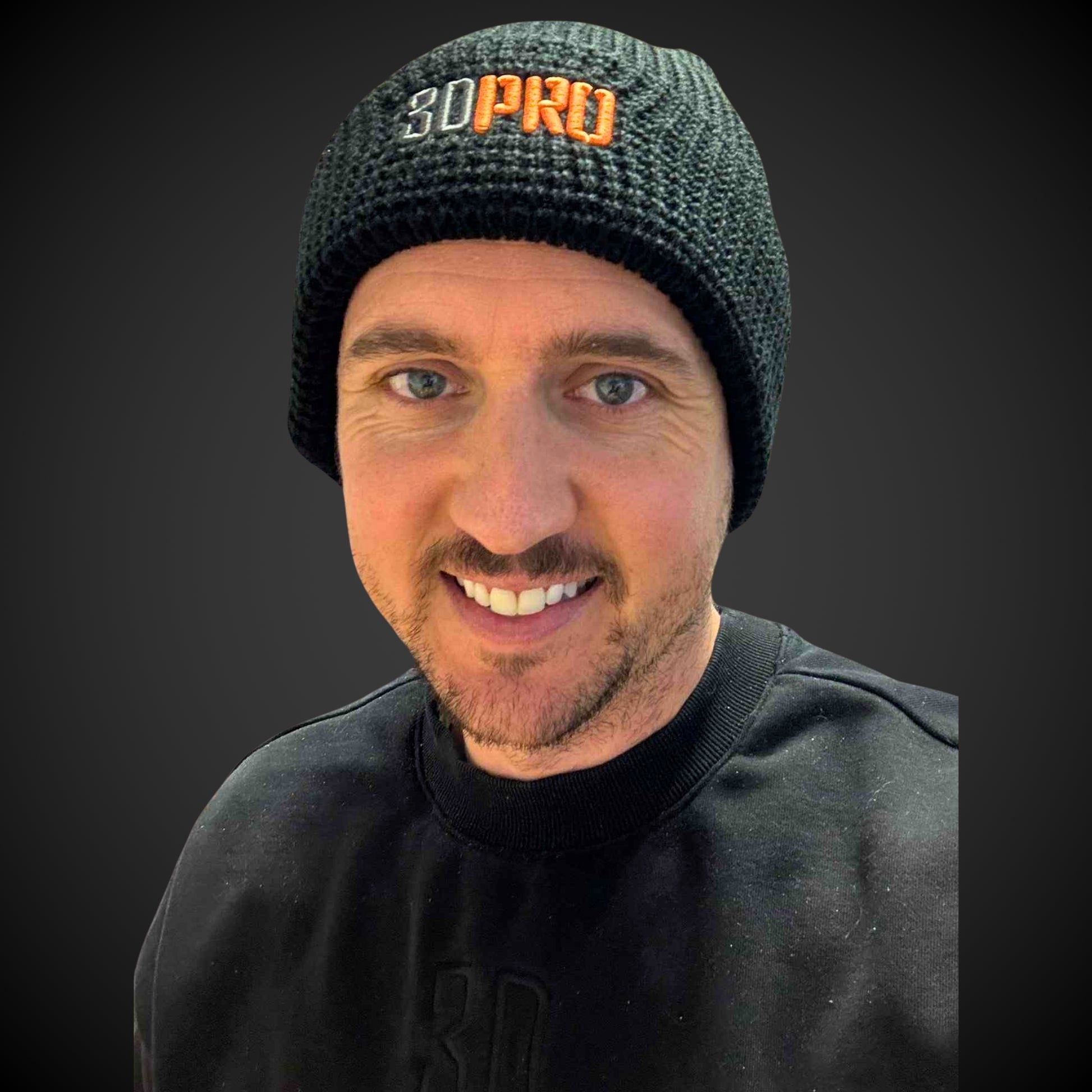 Luke wearing a black beanie with '3D Pro' logo on a dark background