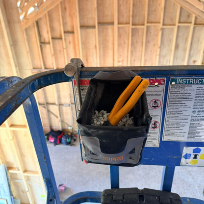 3L Pro Magnetic Folding Bucket On Site with tools on a blue platform in a workshop setting