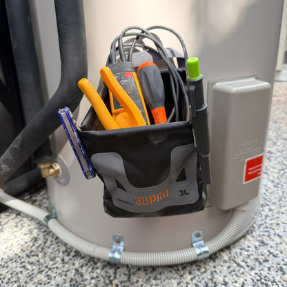 3L Pro Magnetic Folding Bucket On Site with various tools attached to a large cylindrical device labeled '30Pro 3L'.