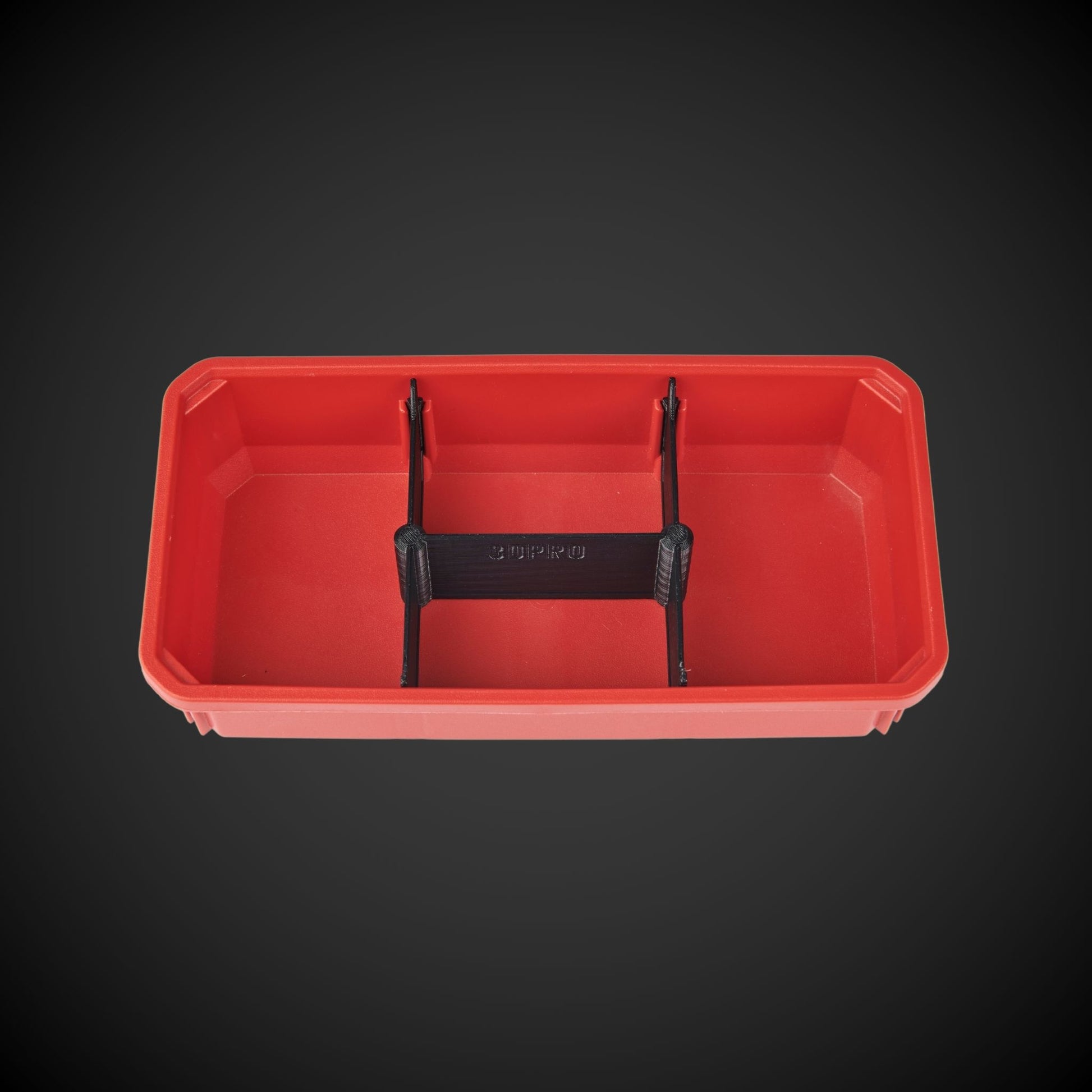 A red 4-way low double bin divider with black accents, designed for organizing tools within a bin.