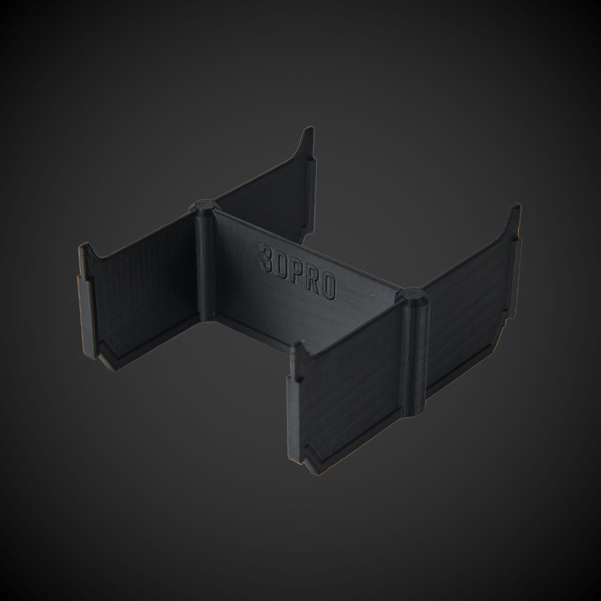 Black 3D-printed object with '3DPRO' branding on a dark gray background