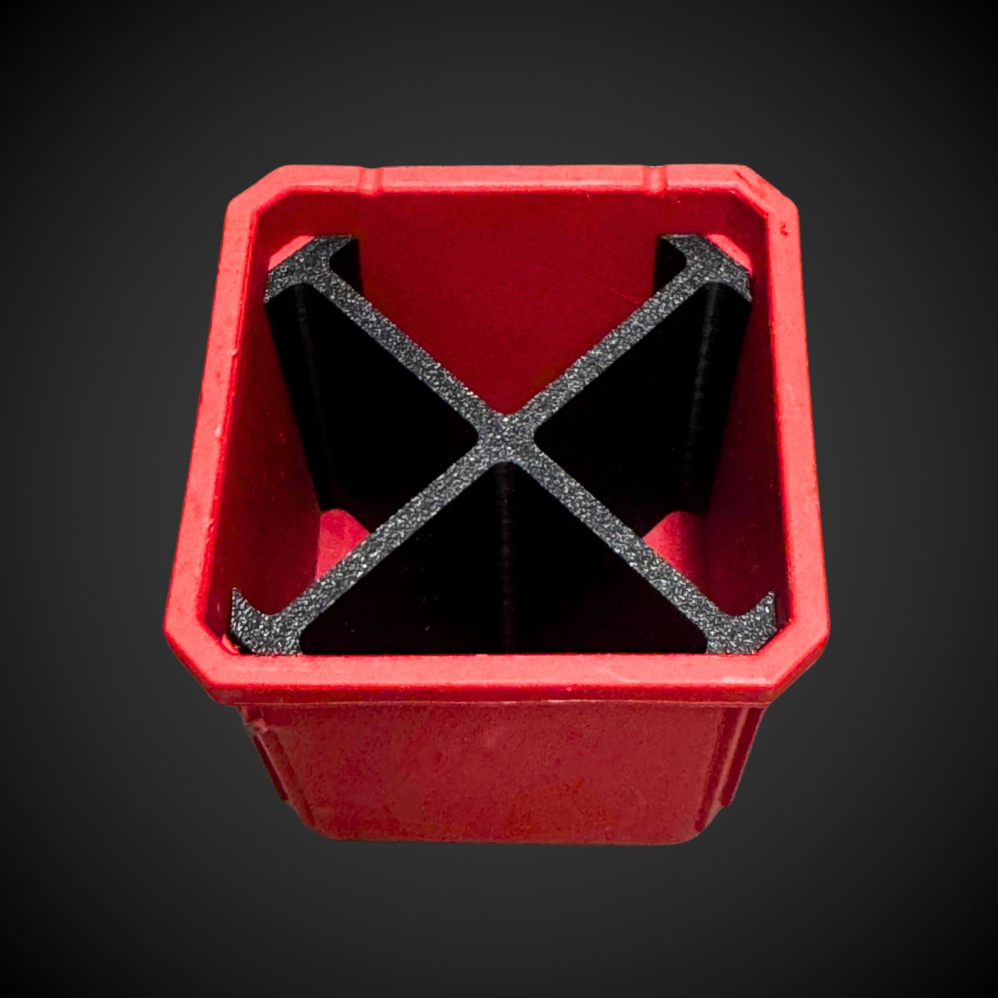 A 3D printed red and black 4-way divider designed to fit inside a Milwaukee Packout standard organizer bin.
