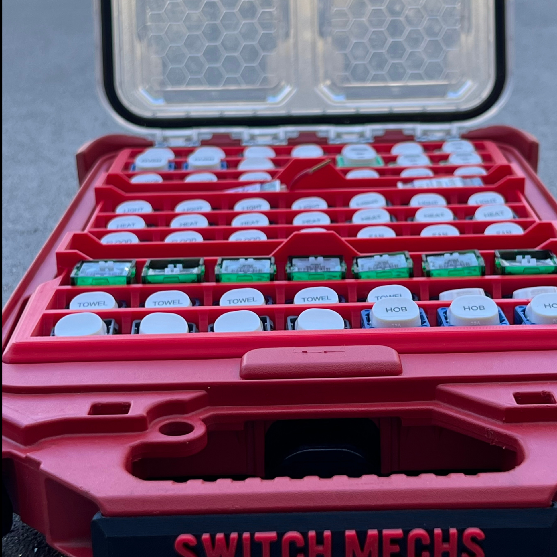 Milwaukee with compartments labeled 'TOWERS', 'HOB', and 'NIB' on a gray surface.