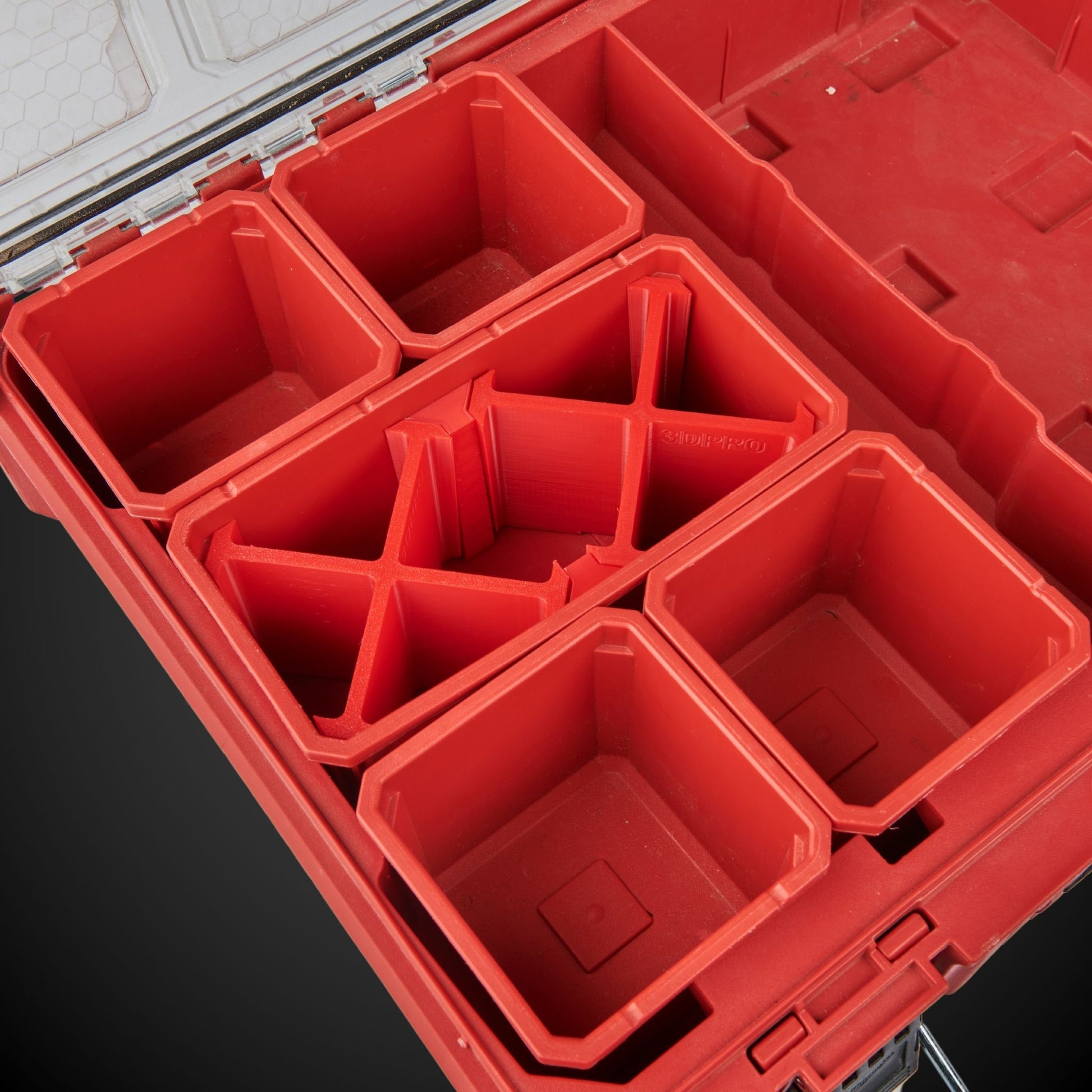 Red Milwaukee tool box with 7-Way Standard Double Bin Divider (MP) on a black background