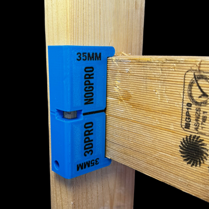 Blue 3DPro Nog Pro - Noggin SetBacks on a wooden surface with visible branding.