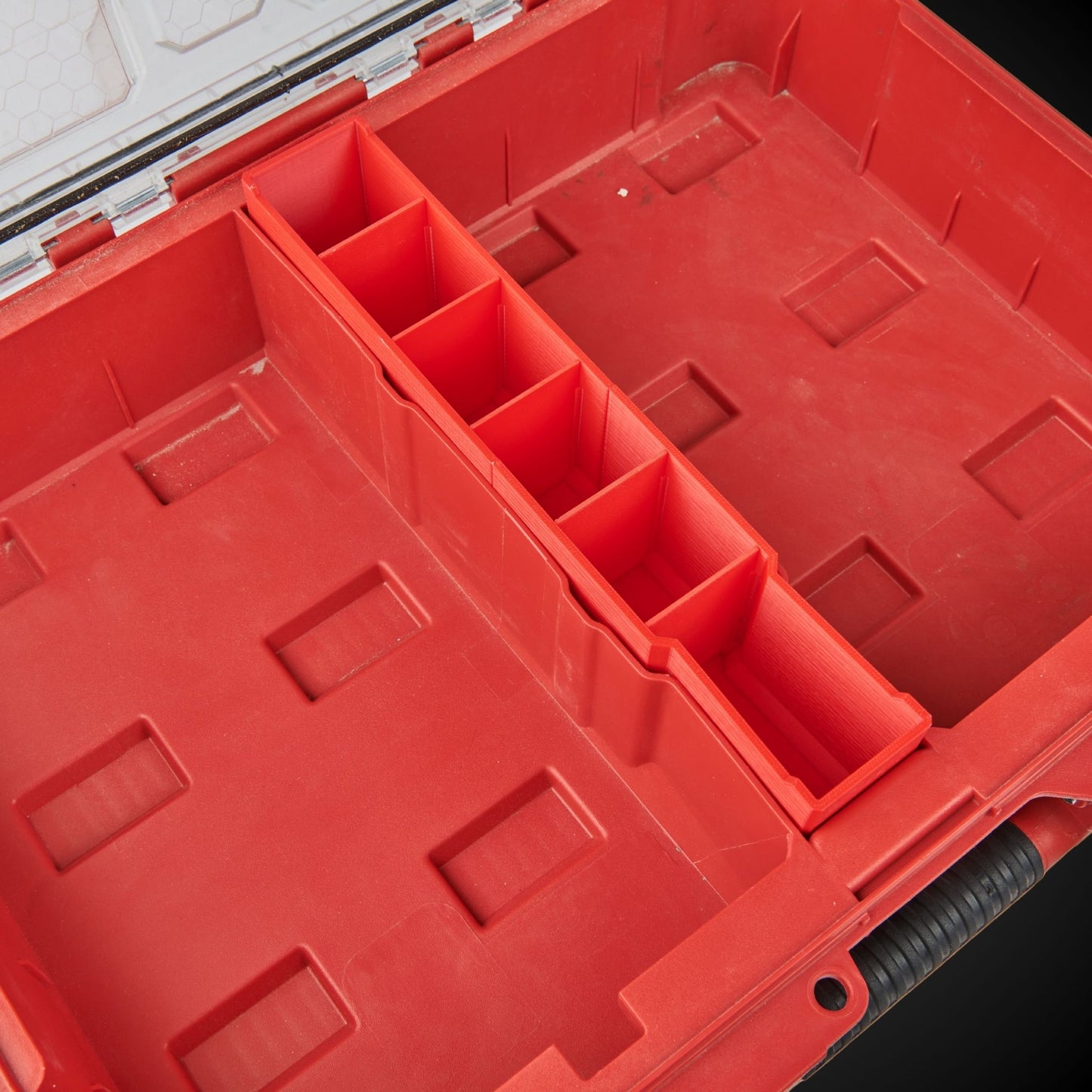 Red tool organizer withCentre Divider Pack (Standard Full Width Packout) on a black background