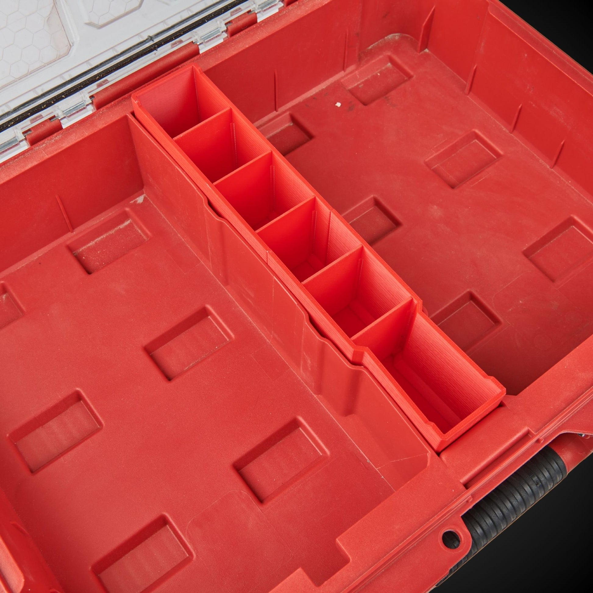 Red tool organizer withCentre Divider Pack (Standard Full Width Packout) on a black background