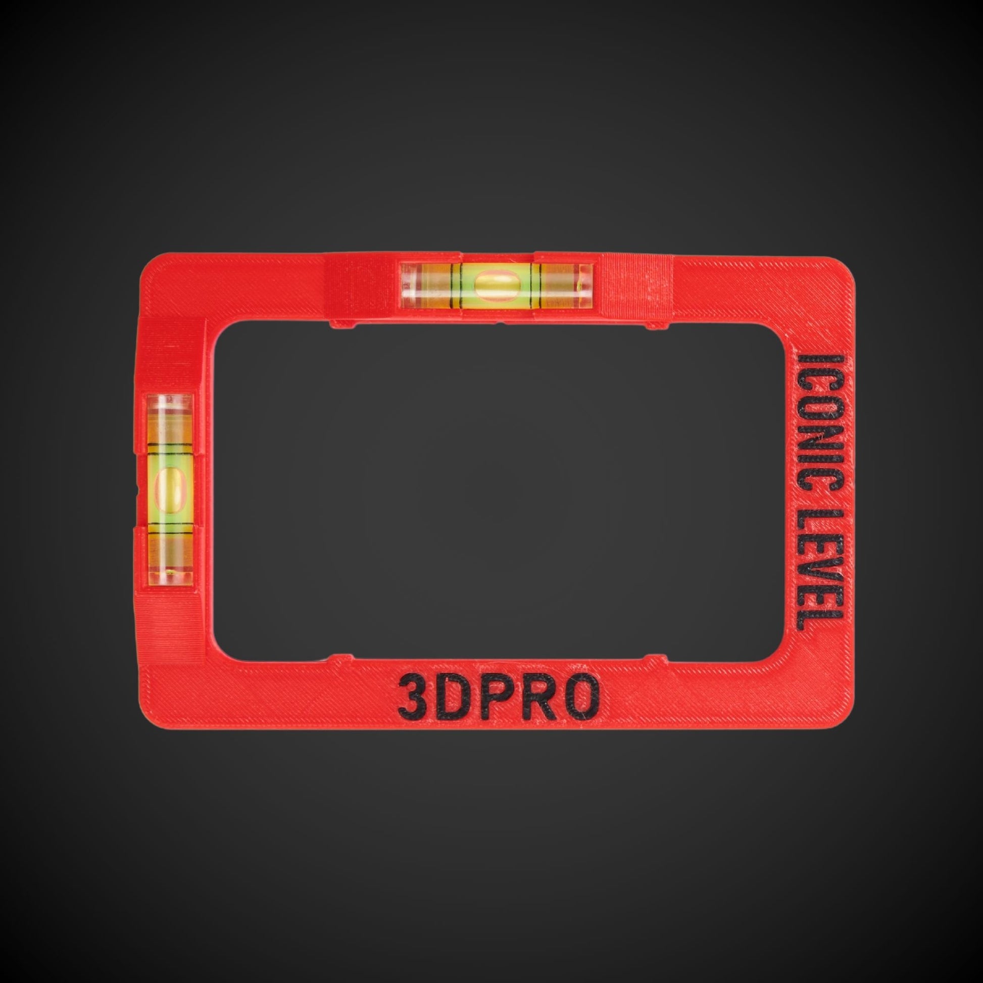 A red Clipsal Iconic clip-on level with vertical and horizontal spirit levels, designed to attach to a powerpoint or switch plate.