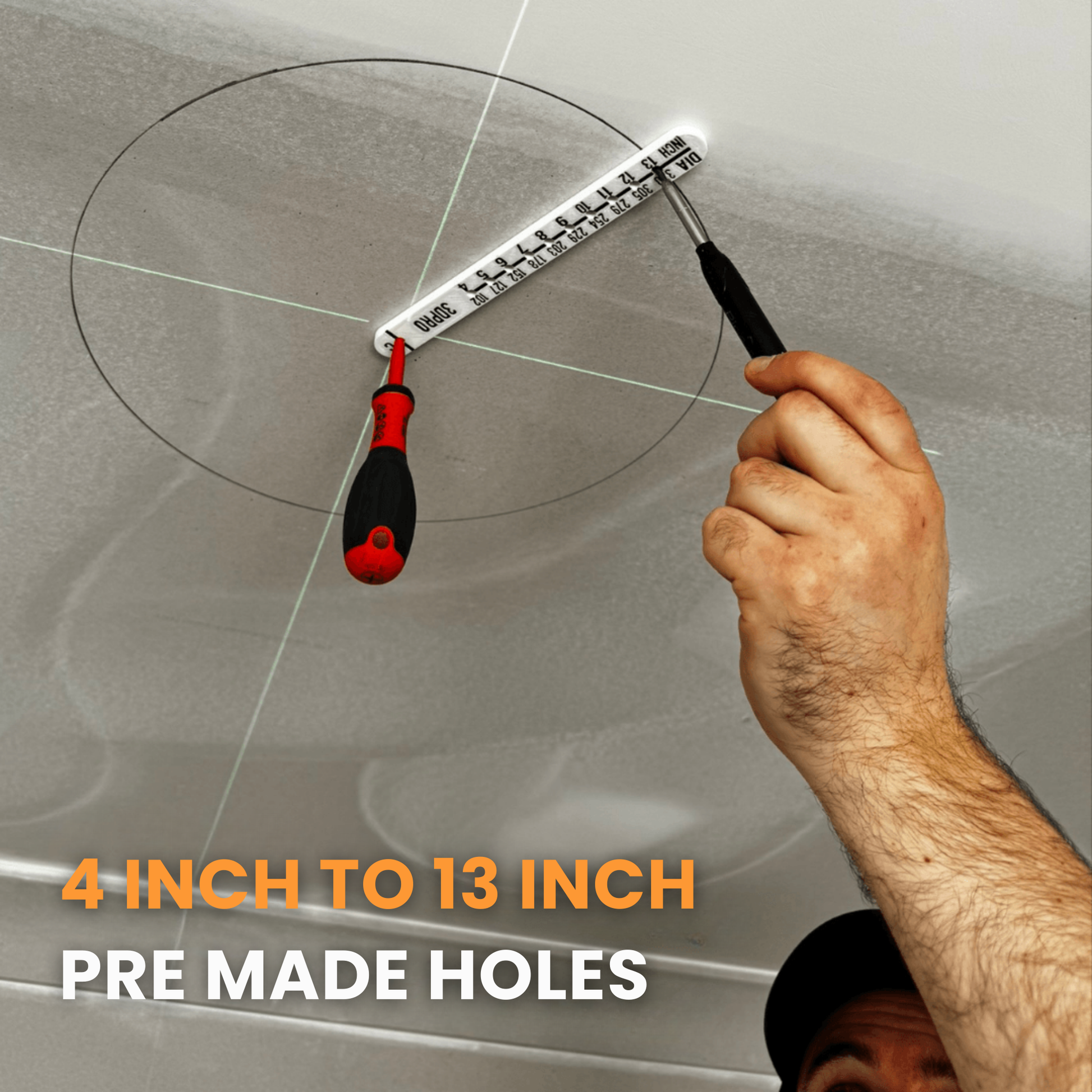 Hand using imperial cut out tmeplate to create pre-made holes on the ceiling