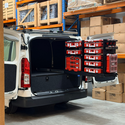Hiace Van with open cargo area loaded with red Milwaukee toolboxes in a warehouse setting