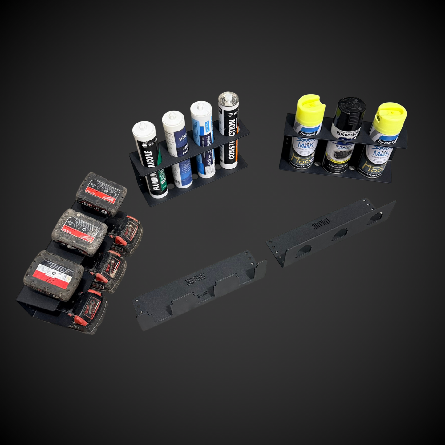 Collection of spray cans and small containers on a dark background