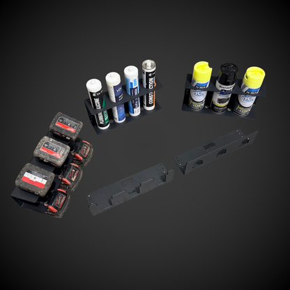 Collection of spray cans and small containers on a dark background