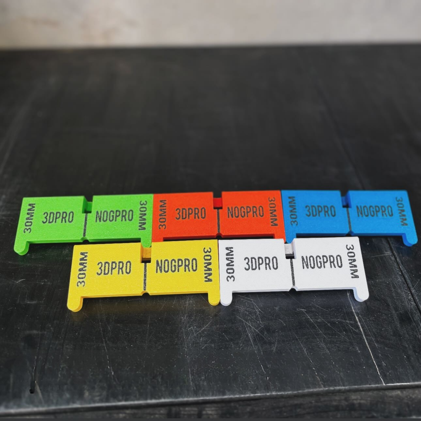 Colorful Nog Pro - Noggin SetBacks with '3DPRO' and 'NOGPRO' branding on a black surface.