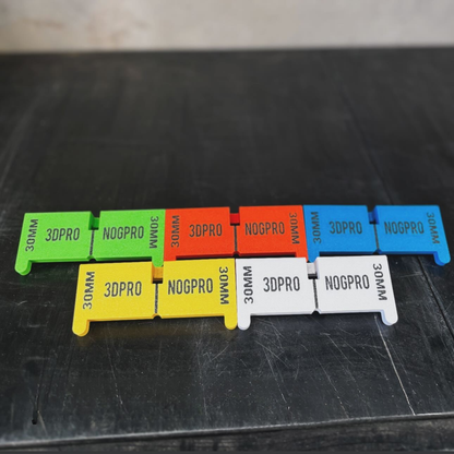 Colorful Nog Pro - Noggin SetBacks with '3DPRO' and 'NOGPRO' branding on a black surface.