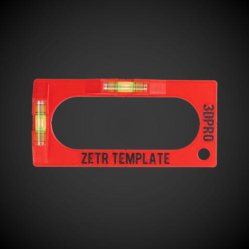 A red template with black text labeled 'ZETR TEMPLATE', featuring a horizontal and vertical spirit level and a trace cut out tool with pencil for electrical powerpoints and light switches.